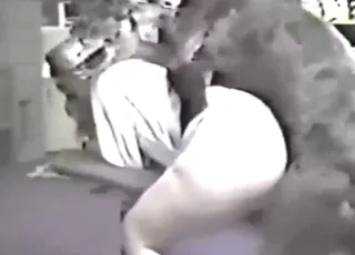 Blonde babe gets screwed from behind by a dog